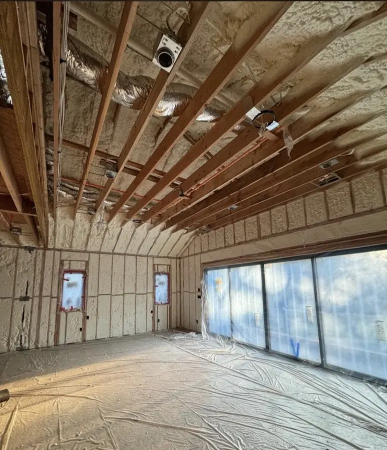 Interior walls and ceiling insulated with spray foam during new construction in Eau Claire
